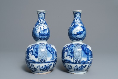 A pair of Dutch Delft blue and white double gourd chinoiserie vases, 18th C.